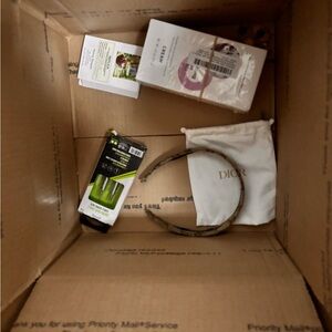 Random items I have plenty of boxes with jewelry and random items for you .